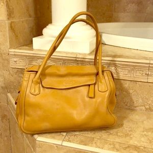 Authentic Tod’s beige purse, in good condition.